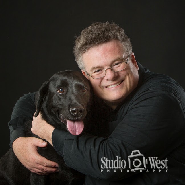 photo of black dog on black background - Studio 101 West Photography