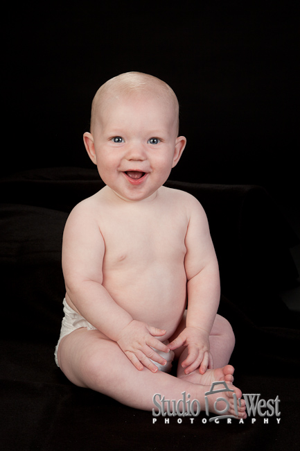 1 year old baby portraits in the studio baby on black background