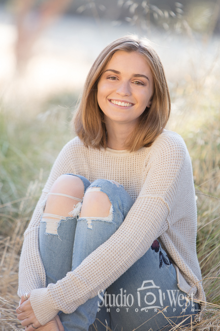 senior picture of girl in field of grass templeton high school senior portrait photographer