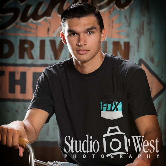 In Studio High School Senior Portrait High School Senior Portrait - Studio Portrait - Rustic Ghost Sign Background - Studio 101 West Photography
