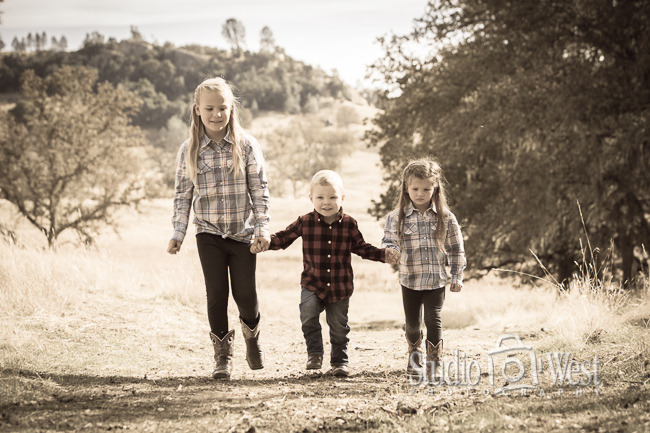Grandkids holding hands walking on a trail portrait RanchFamily Portrait - Paso Robles Family Portraits - Studio 101 West Photography